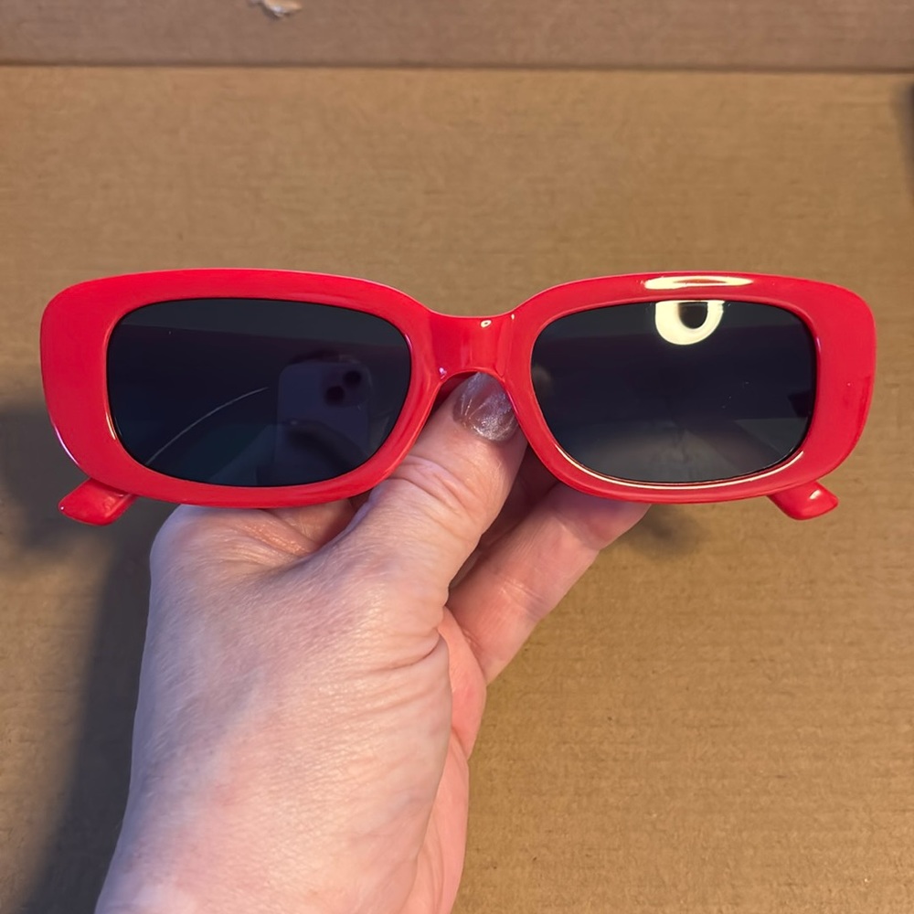 bright red rectangular sunglasses with black lenses